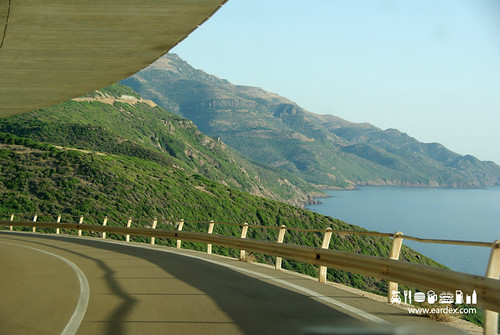 Scenic highway and coastal road winding through Sardinian mountains